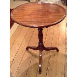 A 19TH CENTURY DISHED TOP OCCASIONAL TABLE With central column raised on three splayed legs. (approx