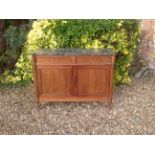 A 19TH CENTURY FRENCH MAHOGANY SIDE CABINET The grey marble top above two drawers and cupboards,