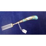 AN 18TH CENTURY PORCELAIN HANDLED FORK The pistol grip handle decorated with an exotic bird in a