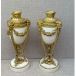 A PAIR OF 19TH CENTURY URN SHAPED CASSOLETTE CANDLESTICKS Having white marble and gilt bronze