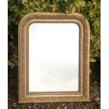 A 19TH CENTURY GILT FRAMED MIRROR Having an arched top and moulded floral decoration. (approx 34cm x