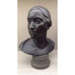 E.H.(?), 20TH CENTURY, BRONZE PORTRAIT BUST Of a lady, signed to reverse and mounted on a grey