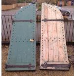 A PAIR OF VICTORIAN GOTHIC ARCH Pine doors with heavy iron hinges. 262 x 160