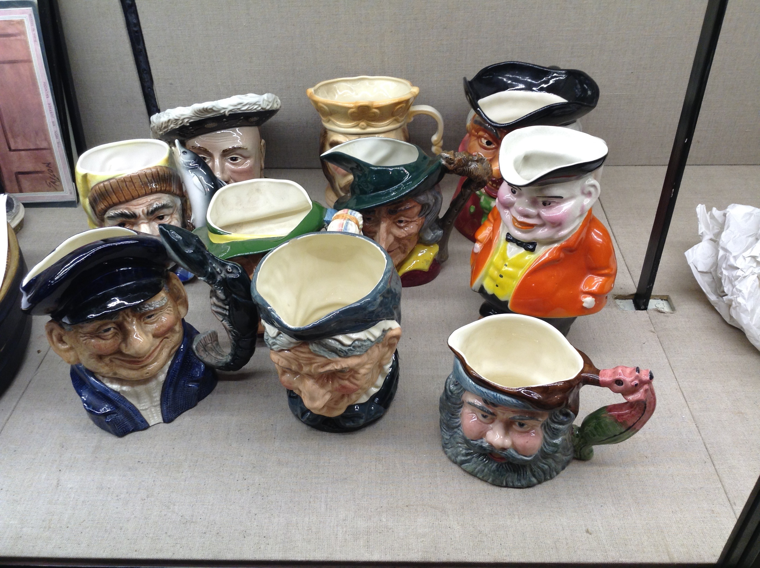 A COLLECTION OF TEN CHARACTER JUGS Including three Royal Doulton, 'Pied Piper' (D6403) (AF), '