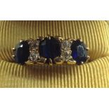 A SAPPHIRE AND DIAMOND YELLOW GOLD RING