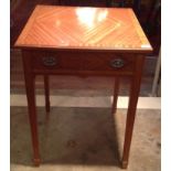 AN EDWARDIAN SATINWOOD SIDE/OCCASIONAL TABLE With a single drawer, raised on square tapering legs.