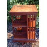 A MATCHED PAIR OF EDWARDIAN MAHOGANY REVOLVING BOOKCASES. (49cm x 50cm x 86cm) Condition: one has