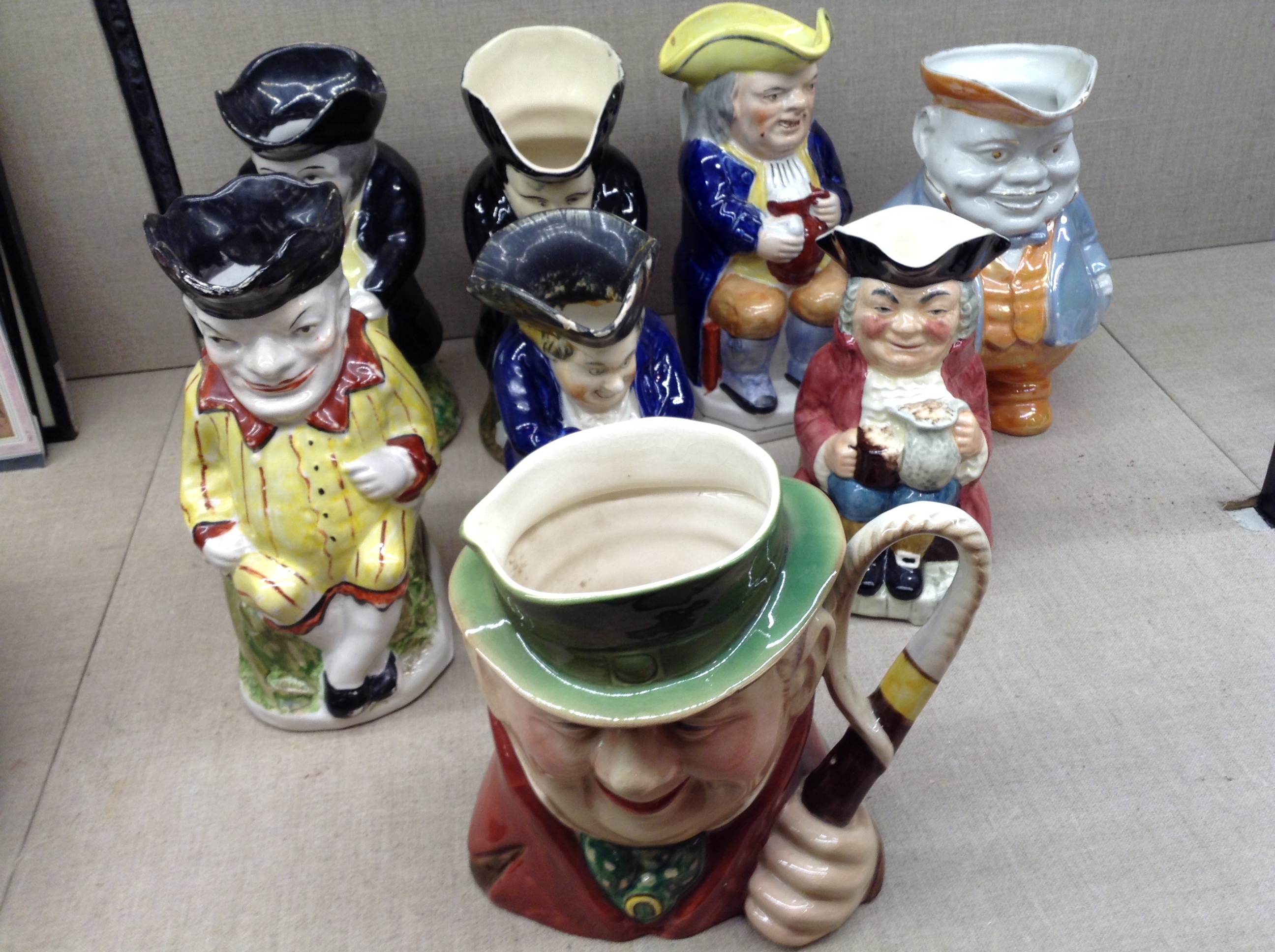 A COLLECTION OF SEVEN 19TH CENTURY AND LATER TRADITIONAL TOBY JUGS To include 'Punch', 'The