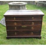 AN 18TH CENTURY OAK CHEST With an unusual configuration of one long drawer above two short and two