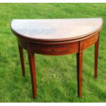 A GEORGE III PERIOD MAHOGANY FOLD OVER CARD TABLE Of unusual oval form, the flame top unfolding to