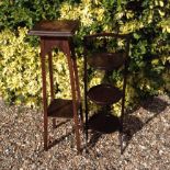 AN EDWARDIAN OAK PLANT STAND Having a lower tier and raised on square legs, together with a 20th