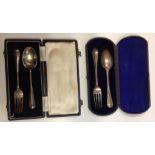 TWO CASED EDWARDIAN HALLMARKED SILVER KNIFE AND FORK SETS.