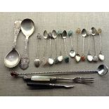 A SET OF TWELVE WHITE METAL SPOONS With various stone finials and large twizzle sticks, to include a