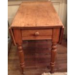 A VICTORIAN STYLE PINE PEMBROKE TABLE.