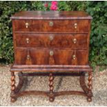 A LATE 17TH CENTURY LABURNUM CHEST ON STAND The crossbanded and oval inlaid top above three long