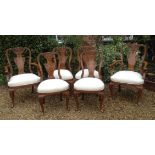 WARING & GILLOW A set of six George I design walnut dining chairs, including two carvers, having