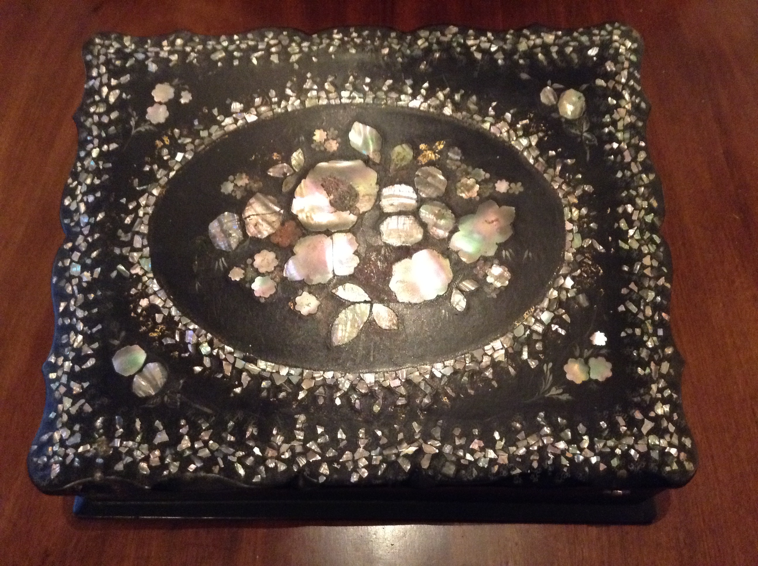 A VICTORIAN PAPIER MÂCHÉ AND MOTHER OF PEARL INLAID WRITING SLOPE With painted decoration, the
