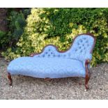 A VICTORIAN MAHOGANY FRAMED CHAISE LOUNGE The deep serpentine shaped frame upholstered in a button