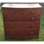 AN EARLY VICTORIAN MAHOGANY BOW FRONTED CHEST  Of two short above three long drawers, fitted with