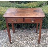 AN 18TH CENTURY OAK SIDE TABLE With two drawers, raised on square chamfered legs.