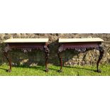 A FINE PAIR OF EARLY 19TH CENTURY IRISH MAHOGANY CONSOLE TABLES The champagne marble tops resting on