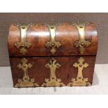 A VICTORIAN BURR WALNUT DOME TOP TEA CADDY Having Gothic style brass mounts and lids with ivory