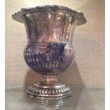 A 19TH CENTURY SILVER PLATED CHAMPAGNE ICE BUCKET Having reeded fluted decoration, with a