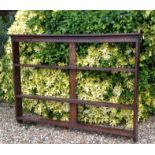 AN EARLY 19TH CENTURY OAK WALL MOUNTING PLATE RACK With a stepped cornice above three open shelves.