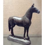 CHAS CURRY An early 20th Century American bronze study of a thoroughbred horse, signed on oval base.