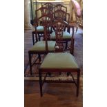 A SET OF SIX GEORGIAN DESIGN DINING CHAIRS With pierced back splats, upholstered drop-in seats and