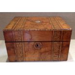 A VICTORIAN FIGURED WALNUT BOX With inlaid Greek Key decoration and a secret drawer, with later