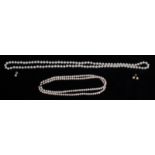 A TWO STRAND PEARL AND DIAMOND NECKLACE  Together with a single string of pearls and a pair of