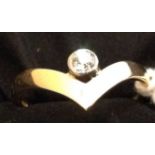 AN 18CT GOLD WISHBONE RING Set with a single diamond. (599990515)