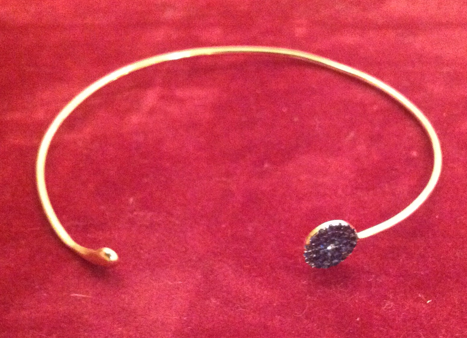 A DELICATE SAPPHIRE AND DIAMOND SET HIGH CARAT YELLOW GOLD BANGLE Marked '.750', along with two