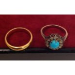 A TURQUOISE AND DIAMOND SET YELLOW METAL RING  Together with a yellow metal band, size N/M. (571)