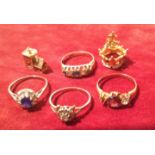 FOUR GOLD GEM SET RINGS To include a rose gold and diamond ring, with a central faceted amethyst,