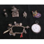 A COLLECTION OF SILVER CURIOSITIES  Including a silver gentleman's pocket watch, with white enamel