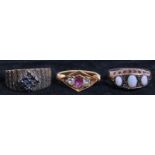 THREE GOLD LADIES RINGS To include an Indian gold, ruby and diamond ring, a three stone gold and