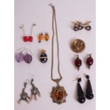 A QUANTITY OF JEWELLERY  To include a Victorian mourning brooch, six pairs of vintage earrings,