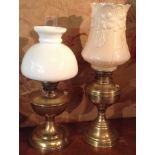 TWO LATE 19TH/EARLY 20TH CENTURY BRASS OIL LAMPS National lamp works having stepped circular bases