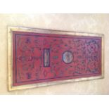 A DECORATIVE RED LACQUERED WALL PANEL  Inset with Venetian scenes.  (80cm x 160cm) Condition: good