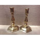 A PAIR OF GEORGE I BRASS CANDLESTICKS Having hexagonal bases. (approx 15½cm) Condition: good