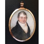 AN 18TH CENTURY IVORY PORTRAIT MINIATURE  Of a gentleman wearing a black coat, with a white