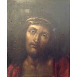 AN 18TH CENTURY OIL ON PANEL Christ weeping, dressed in a red robe and thorn crown. (approx 23cm x