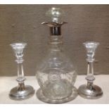 AN ANTIQUE TRIPLE NECK RING CUT CRYSTAL DECANTER AND STOPPER Having a hallmarked silver collar and a