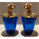 A PAIR OF BLUE GLASS JARS WITH SHORT-TAILED EAGLE ORMOLU MOUNTED COVERS The circular section vessels