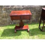 AN EARLY 19TH CENTURY MAHOGANY SIDE TABLE With three false and one real drawer raised on a lyre