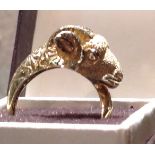 AN ANTIQUE GOLD RING Figured with a rams head.