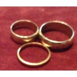 A COLLECTION OF THREE 20TH CENTURY WEDDING BANDS Hallmarked 22ct, 18ct and 9ct.