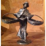 AN ART NOUVEAU SILVER PLATED PEWTER FIGURE Of a woman holding two large baskets to her sides. (h